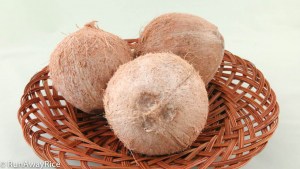 Whole Coconuts - the lighter the outer covering, the younger the coconut.