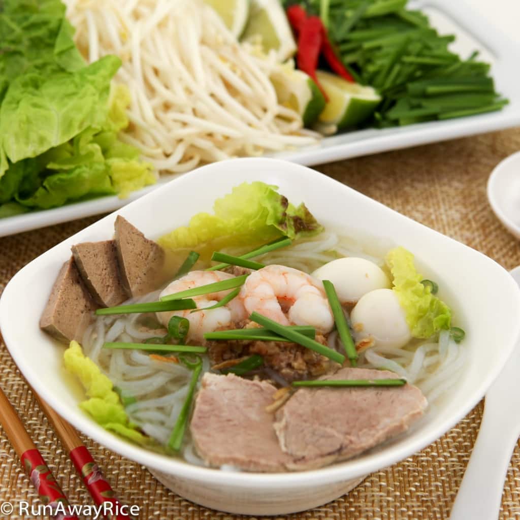 Pork and Shrimp Glass Noodle Soup (Hu Tieu) with Fresh Herbs and Vegetables Plate | recipe from runawayrice.com
