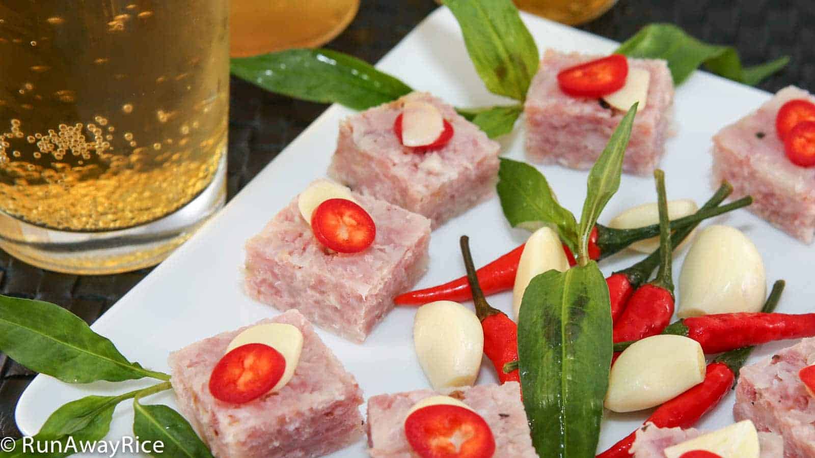 Cured Fermented Pork / Nem Chua served with Vietnamese coriander, red chilies and garlic slices | recipe from runawayrice.com